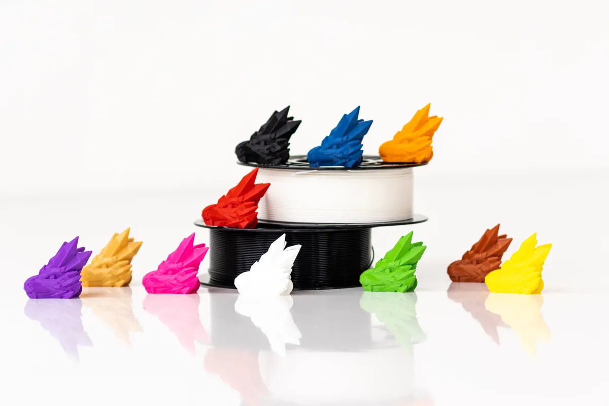 Creative 3D prints — dragon heads and bunnies in vibrant colors